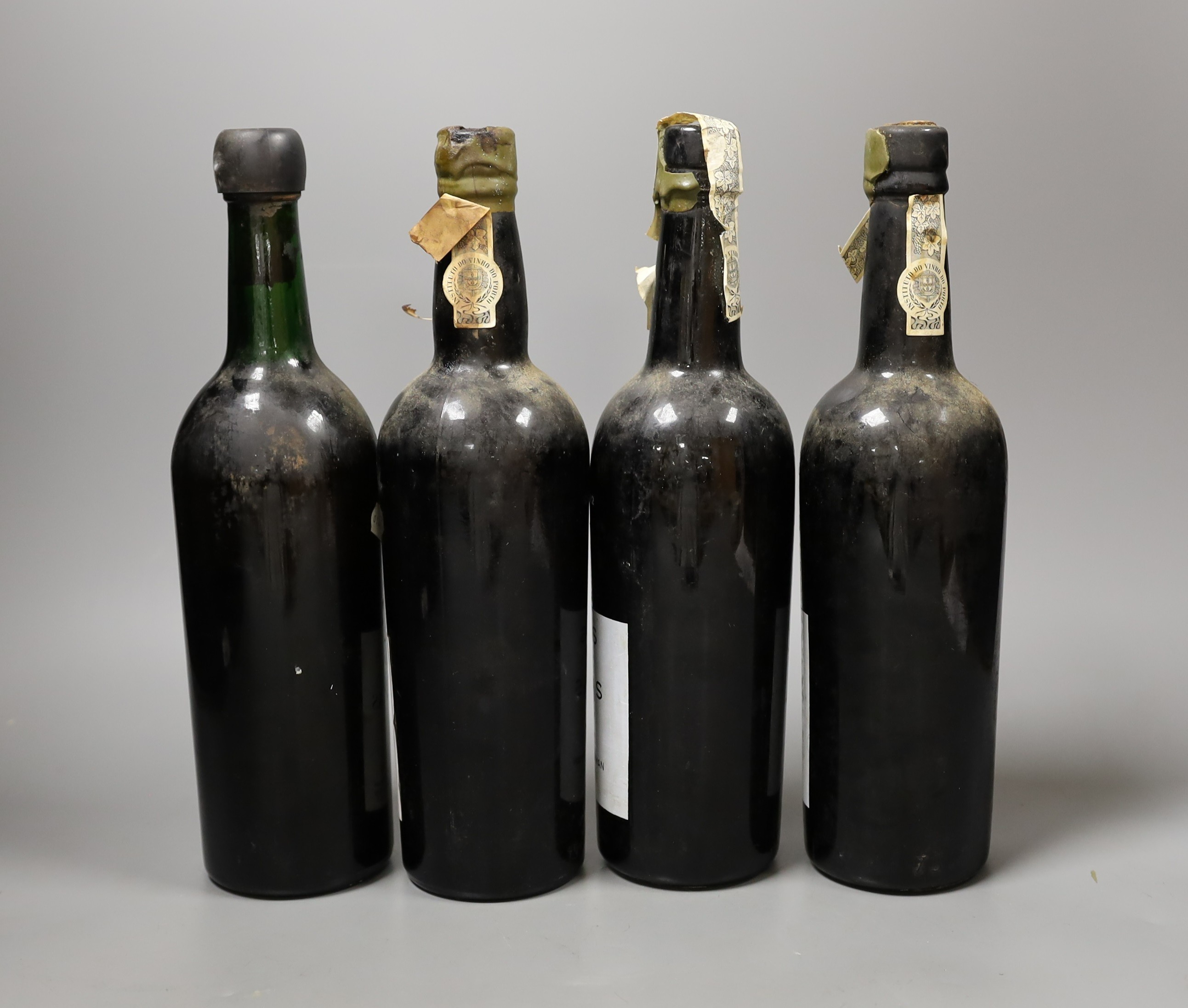 A four bottles of Taylor’s Quinta De Vargellas vintage port, two bottles dated 1965, one dated 1967 and the other 1972